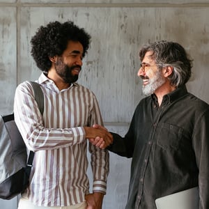  Two colleagues shake hands after deciding on a strategy